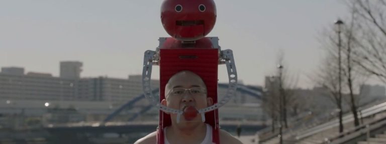 Tomatan, a wearable robot that feeds you tomatoes.